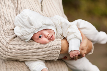 old woman holding her grandson