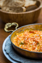 Menemen,Traditional Turkish Scrambled Eggs, Mixed with Tomatoes, peppers and, sometimes, onions. 