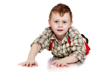 Funny little boy crawling on the floor