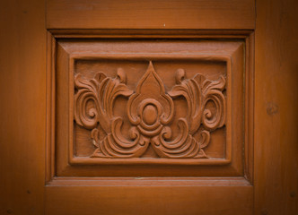 flower carved on wood background