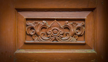 flower carved on wood background