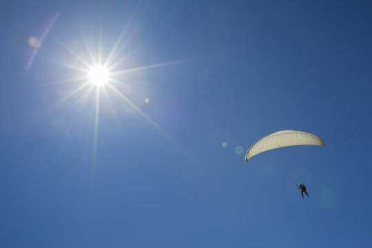 Sail of a paraglider in a blue sky