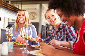 Female friends eating at a restaurant