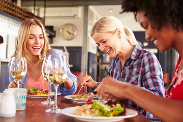 Female friends eating at a restaurant