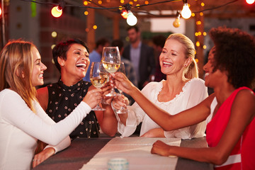 Girlfriends at rooftop party