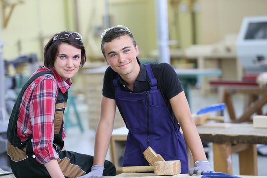 Portrait of young apprentices in carpentry school