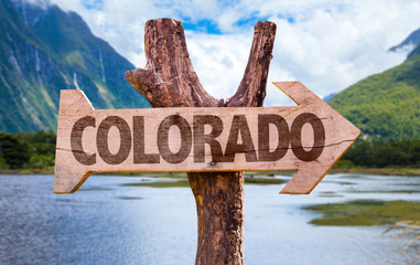 Colorado wooden sign with mountains background