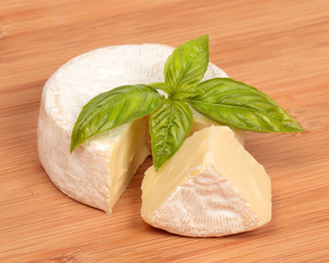 Brie cheese with a basil