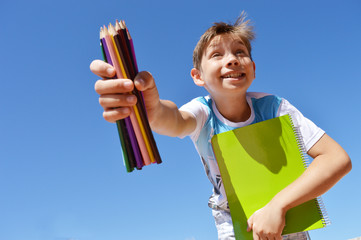 Happy student with books