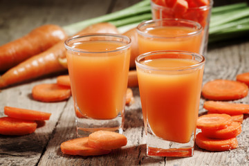 Fresh carrot juice in the glass, selective focus