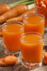 Fresh carrot juice in the glass, selective focus