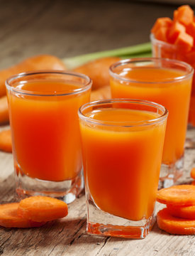 Fresh carrot juice in the glass, selective focus