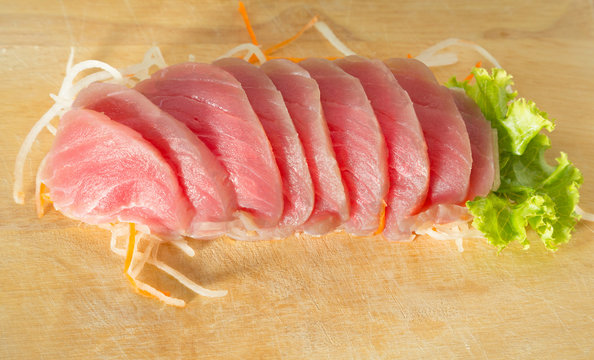 fresh sashimi saimon on wood background 