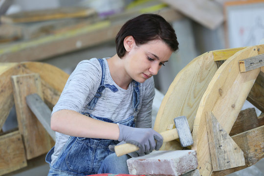 Young woman in masonry professional school