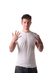 Fototapeta premium Handsome young man counting to eight 8 with fingers and hands