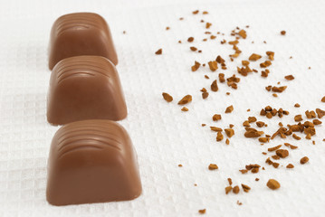 Top view of chocolate pralines on white towel