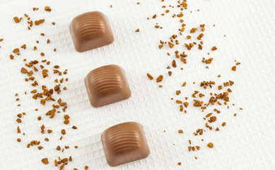 Top view of chocolate pralines on white towel