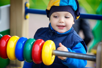 Boy Playing on Playground