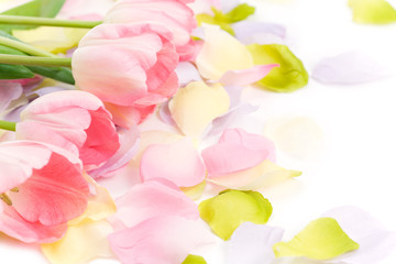 Obraz na płótnie Canvas Easter Floral Design Element with fresh pink tulips on pastel silk floral petals. 