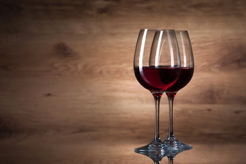 Wine. Two wine glasses on a wooden background
