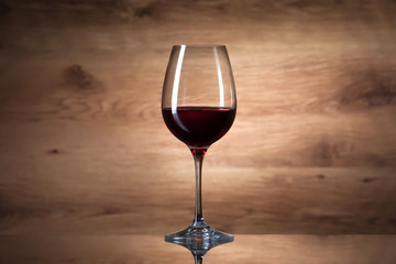 Wine. Wine glass on a wooden background