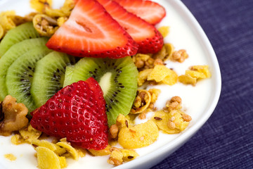 Mixed fruit with granola & plain Greek yogurt.