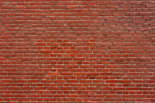 Brick wall. The traditional brickwork made of red bricks.