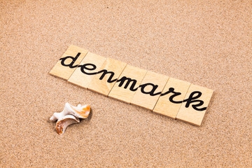 Words formed from small pieces of wood containing a sun and beach tourist destination, Denmark