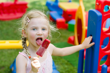 girl eating ice lolly © katarinagondova