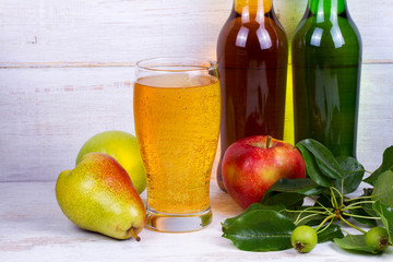 Glass and bottles of cider