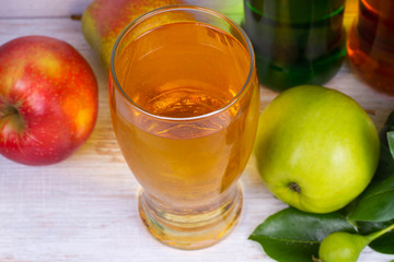 Glass and bottles of cider