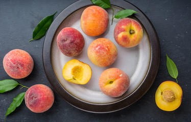 Ripe juicy peaches on a plate ready to eat
