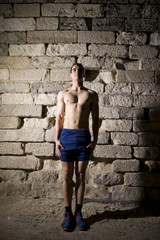 Young athlete warming in tunnel