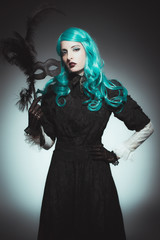 Woman in Vintage Gown with Dramatic Mask