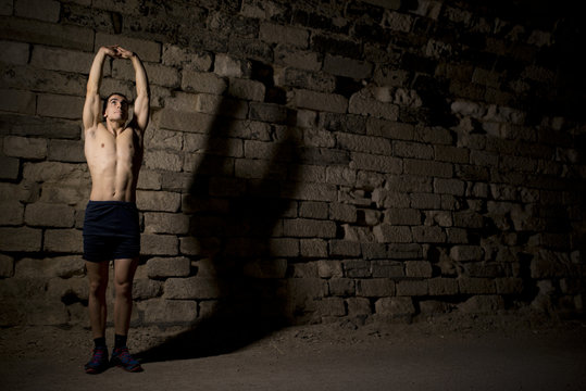Young athlete warming in tunnel