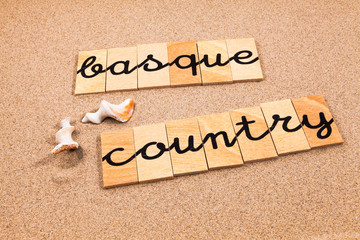 Words formed from small pieces of wood containing a sun and beach tourist destination, Basque Country