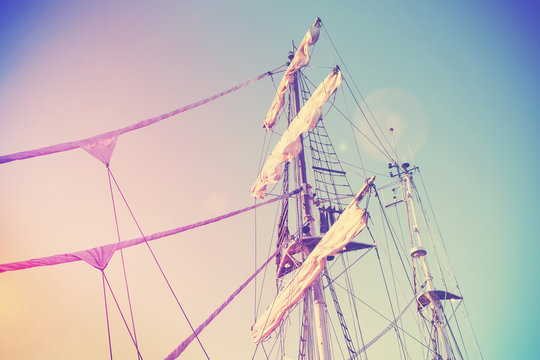 Vintage retro filtered picture of a sailing ship mast.