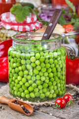Canned peas with different fruits and vegetables in the background
