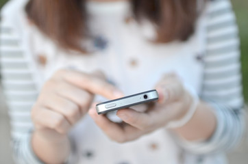 Young girl touching smart phone