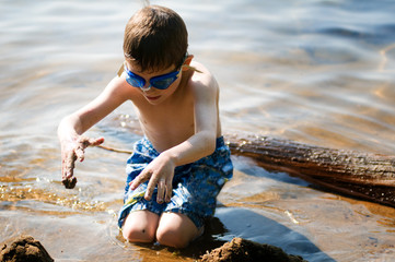boy playing at the beach