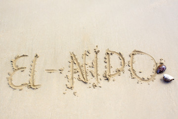 inscription on the sand word El Nido