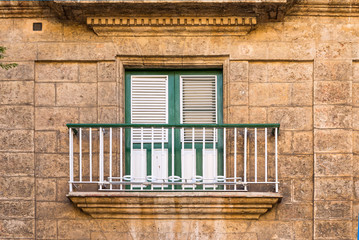 Balcony with a green door