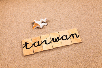 Words formed from small pieces of wood containing a sun and beach tourist destination, Taiwan