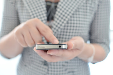 Young girl touching smart phone