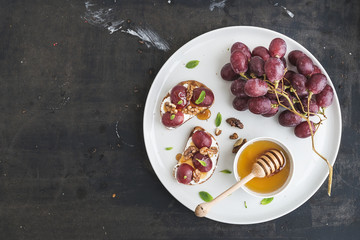 Breakfast set. Sweet sandwiches with ricotta cheese, grapes