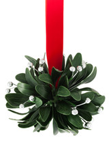 Mistletoe with silver berries and red ribbon, isolated on white background. 