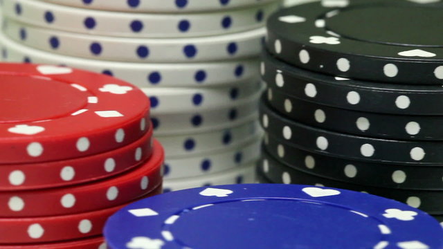 Pan over stacked casino poker chips