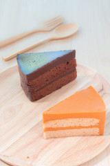 Thai tea cake and chocolate cake with soft focus.