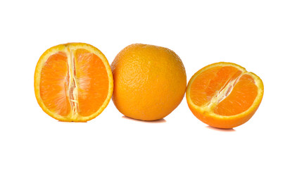whole and sliced orange on white background