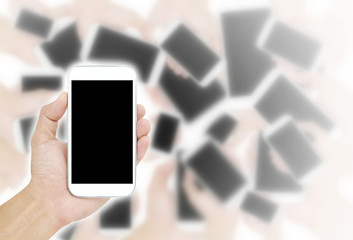 Hand holding White Smartphone with blank screen